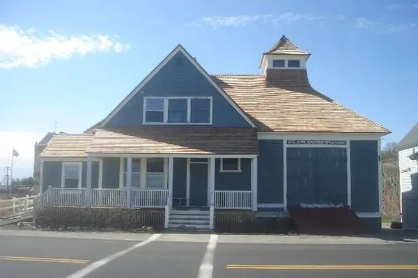 Blue home with new cedar shake roof