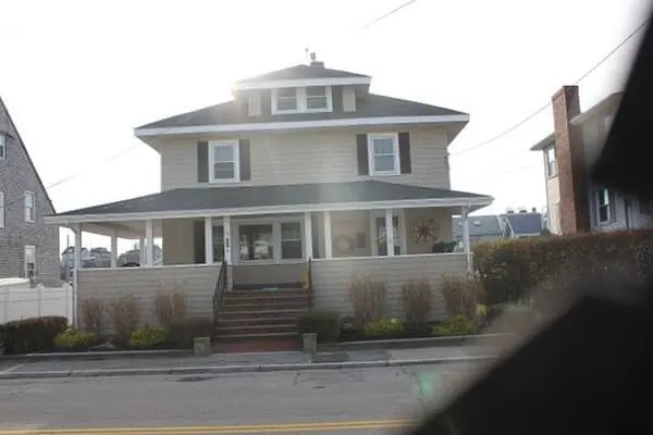 Remodeled home exterior with wraparound porch